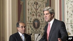 Senate Foreign Relations Committee Chairman Sen. John Kerry (r) with Mahmoud Jibril, representative for foreign affairs with the Libyan Transitional National Council, after their meeting on Capitol Hill in, May 11, 2011