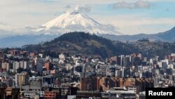 FILE - The Cotopaxi volcano spews smoke as seen from north of Quito, Ecuador Sept. 16, 2016.