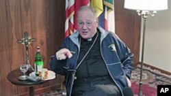 Archbishop of New York, Timothy Dolan, gestures during an interview at the North American College in Rome, February 14, 2012.