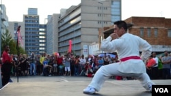 A martial arts demonstration at Saturday's Chinese New Year festivities in downtown Johannesburg. The first Chinese immigrants in Johannesburg starting coming around 1900, February 2, 2013 (Peter Cox/VOA).