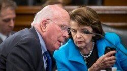 FILE - Democratic Senator Patrick Leahy (L) speaks with colleague, Senator Dianne Feinstein, during a meeting on Capitol Hill in Washington, March 10, 2016.