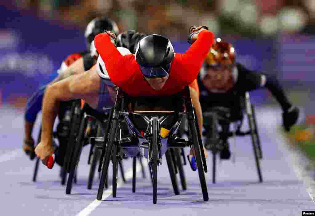 Xingchuan Luo of China leads the men's 1500m T54 round 1 at the Stade de France, Saint-Denis, France, during the Paris Paralympics, Sept. 2, 2024.