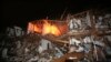 A fire still burns in a apartment complex destroyed near a fertilizer plant that exploded earlier in West, Texas, in this photo made early Thursday morning, April 18, 2013.