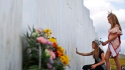 Mackenzie, right, and Madison Miller from Avonmore, Pa., visit the Wall of Names at the Flight 93 National Memorial in Shanksville, Pa., Thursday, Sept. 10, 2020, as the nation prepares to mark the 19th anniversary of the Sept. 11, 2001, attacks. The Wall