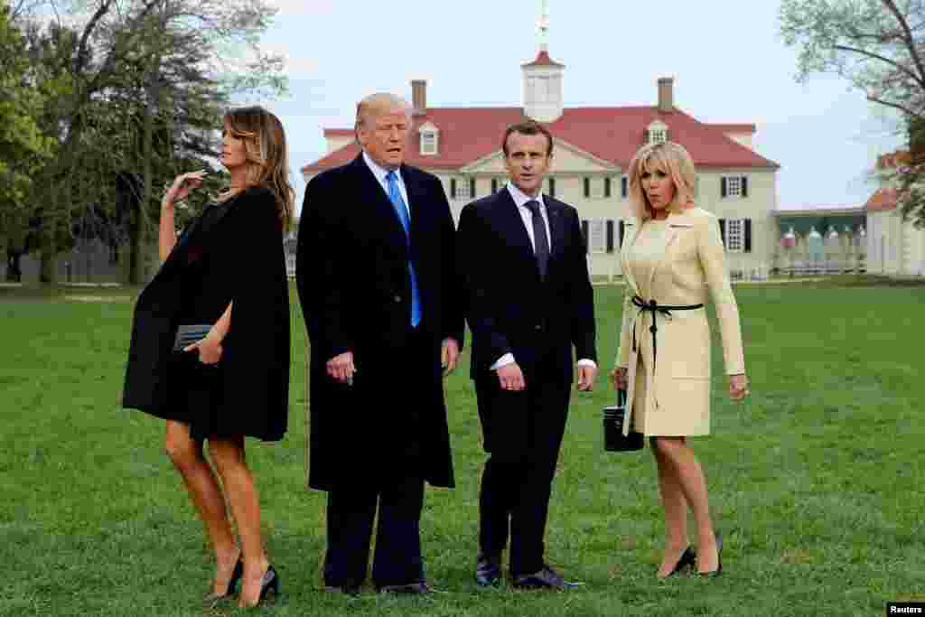 U.S. President Donald Trump and first lady Melania Trump and French President Emmanuel Macron and Brigitte Macron prepare to have their picture taken on a visit to the estate of the first U.S. President George Washington in Mount Vernon, Virginia outside Washington, April 23, 2018.