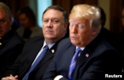 FILE - U.S. Secretary of State Mike Pompeo listens as President Donald Trump speaks during a cabinet meeting at the White House in Washington, July 18, 2018.