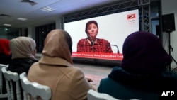 FILE: Sihem Bensedrine, head of the Truth and Dignity Commission (IVD), takes part in an open forum as relatives of abuse victims watch a live broadcast of testimonials by the victims before the IVD in Tunis on December 16, 2016. 