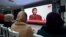 FILE: Sihem Bensedrine, head of the Truth and Dignity Commission (IVD), takes part in an open forum as relatives of abuse victims watch a live broadcast of testimonials by the victims before the IVD in Tunis on December 16, 2016. 