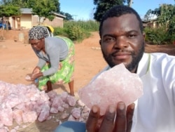 Percy Maleta diplays some of the minerals in Malawi. (Courtesy: of Nyasa Mining Corperative)