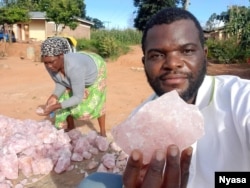 Percy Maleta diplays some of the minerals in Malawi. (Courtesy: of Nyasa Mining Corperative)