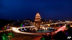 A traffic photo at the Cambodian Independence Monument. (AP Photo/Heng Sinith)