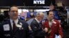 Traders work on the floor of the New York Stock Exchange shortly after the opening bell in New York, Jan. 13, 2017.