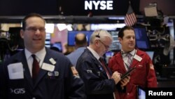 Traders work on the floor of the New York Stock Exchange shortly after the opening bell in New York, Jan. 13, 2017.