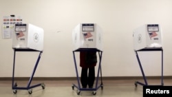 A voter is seen at a polling station during the New York primary elections in the Manhattan borough of New York City, April 19, 2016. Many voters in New York state complained of technical problems and disenfranchisement.