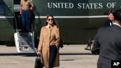 FILE - Presidential adviser Hope Hicks walks from Marine One to accompany President Donald Trump aboard Air Force One as he departs Sept. 30, 2020, at Andrews Air Force Base, Md. 