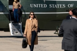 FILE - Counselor to the President Hope Hicks walks from Marine One to accompany President Donald Trump aboard Air Force One as he departs Sept. 30, 2020, at Andrews Air Force Base, Md.