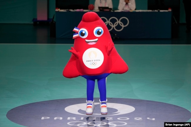 FILE - Phryge, the Olympics 2024 mascot dances at the South Paris Arena during the 2024 Summer Olympics, Monday, July 29, 2024, in Paris, France. (AP Photo/Brian Inganga, File)