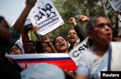Girls shout slogans during a protest demanding equal rights for women on the occasion of International Women’s Day in New Delhi, India, March 8, 2018.
