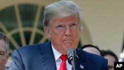 President Donald Trump pauses as he takes questions from members of the media about Supreme Court nominee Judge Brett Kavanaugh in the Rose Garden of the White House in Washington, Oct. 1, 2018. 