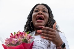 Rep. Cori Bush, D-Mo., cries after it was announced that the Biden administration will enact a targeted nationwide eviction moratorium outside of Capitol Hill in Washington on Tuesday, August 3, 2021.