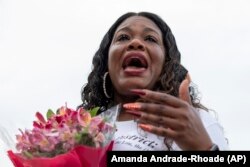 Rep. Cori Bush, D-Mo., cries after it was announced that the Biden administration will enact a targeted nationwide eviction moratorium outside of Capitol Hill in Washington on Tuesday, August 3, 2021.