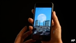 FILE - A smartphone is held for a photograph in New York. 
