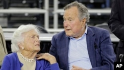 FILE - Former President George H.W. Bush and his wife Barbara Bush are seen in a March 29, 2015, photo.