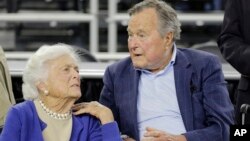 FILE - Former President George H.W. Bush and his wife, Barbara, are seen March 29, 2015.