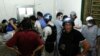 U.N. chemical weapons experts visit a hospital where wounded people affected by a suspected gas attack are being treated, in the southwestern Damascus suburb of Mouadamiya, Aug. 26, 2013. 