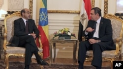 Ethiopian Prime Minister Meles Zenawi, left, meets with then-Egyptian Prime Minister Essam Sharaf, right, in Cairo, Egypt, September 17, 2011.