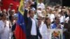 Venezuelan opposition leader and self-proclaimed interim president Juan Guaido waves to supporters during a rally against Venezuelan President Nicolas Maduro's government in Caracas, Venezuela, Feb. 2, 2019.