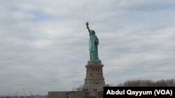 The Statue of Liberty stands in New York Harbor.