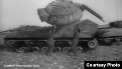 Members of the Ghost Army work with an inflatable tank, one of hundreds of props used to deceive the enemy during World War ll. (Courtesy Plate of Peas Productions)