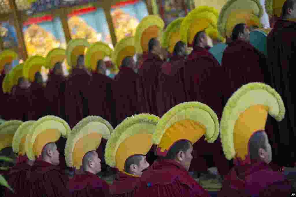 Exile Tibetan Buddhist monks in ceremonial hats participate in a special prayer to prepare for the Tibetan New Year, at the Gyuto monastery near Dharmsala, India.