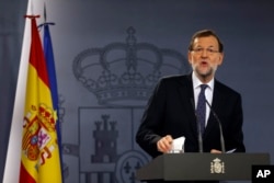 FILE - Spanish Prime Minister Mariano Rajoy delivers a statement on Catalan independence at the Moncloa palace in Madrid, Oct. 27, 2015.