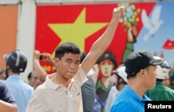 FILE - A protester gestures as he marches during an anti-China protest in Vietnam's southern Ho Chi Minh city, May 18, 2014.