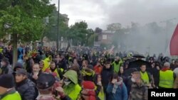 Protesters turn out for the 24th consecutive national weekly protest by the yellow vest movement in Strasbourg, France, April 27, 2019, in this still image taken from a video obtained from social media.