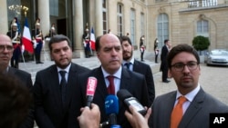 President of the Venezuelan parliament, Julio Borges, center, vice president of the Venezuelan parliament, Freddy Guevara, right, and Venezuelan deputy Eudoro Gonzalez, center left, speak to the press after a meeting with France's President Emmanuel Macron.