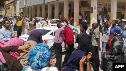 Sudanese protesters take part in an anti-government demonstration in Khartoum, Feb. 14, 2019. 