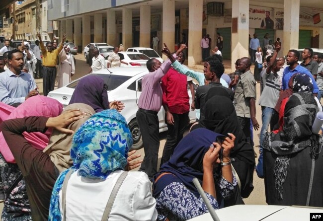 FILE - Sudanese protesters take part in an anti-government demonstration in Khartoum, Feb. 14, 2019.