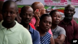 People stand in line to vote during elections in the Petion-Ville suburb of Port-au-Prince, Haiti, Nov. 20, 2016.