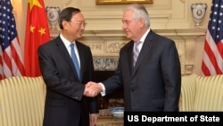 U.S. Secretary of State Rex Tillerson shakes hands with Chinese State Councilor Yang Jiechi at the U.S. Department of State in Washington, D.C.,Feb. 28, 2017.