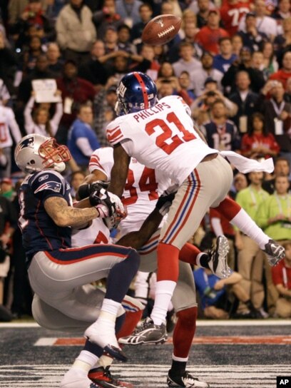 Middle linebacker Chase Blackburn (93) of the New York Giants celebrates  after making an interception against the New England Patriots during Super  Bowl XLVI at Lucas Oil Stadium in Indianapolis, Indiana, USA