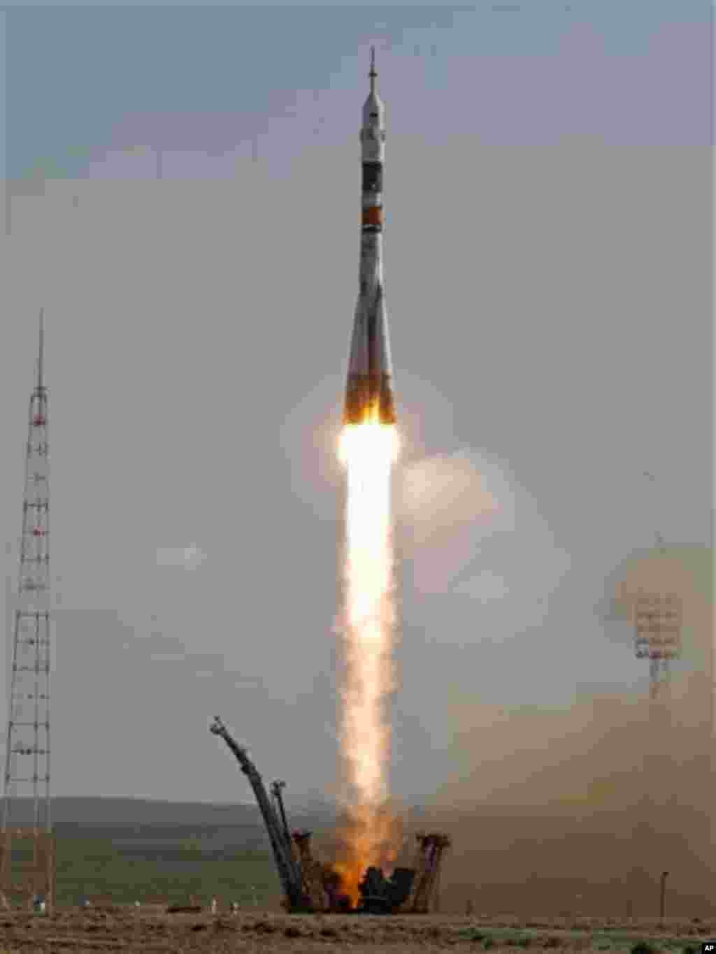 The Soyuz-FG rocket booster with a Soyuz TMA-04M spaceship carrying a new crew to the International Space Station, ISS, blasts off from the Russian leased Baikonur cosmodrome, in Kazakhstan, Tuesday, May 15, 2012. The Russian rocket is carrying U.S. astro