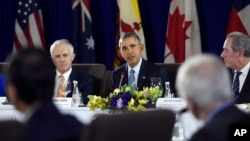 President Barack Obama, center, sitting next to Australia’s Prime Minister Malcolm Turnbull, left, and U.S. Trade Representative Michael Froman, right, speaks during a meeting with other leaders of the Trans-Pacific Partnership countries in Manila, Philippines, Nov. 18, 2015, ahead of the start of the APEC summit.