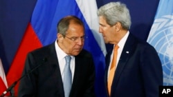 FILE - Russian Foreign Minister Sergei Lavrov, left, speaks to U.S. Secretary of State John Kerry prior to their Syria-related news conference in Vienna, Austria, May 17, 2016.