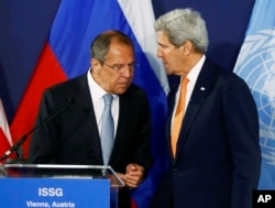 Russian Foreign Minister Sergei Lavrov, left, speaks to U.S. Secretary of State John Kerry prior to their news conference in Vienna, Austria, May 17, 2016.