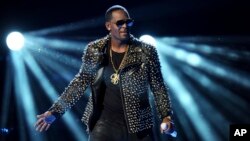 FILE - R. Kelly performs at the BET Awards at the Nokia Theatre in Los Angeles. R. Kelly is announcing a new tour, but it won't be in the United States. 