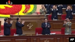 FILE - In this frame taken from TV, North Korean leader Kim Jong Un, center, applauds during the ruling party congress in Pyongyang, North Korea, May 7, 2016.