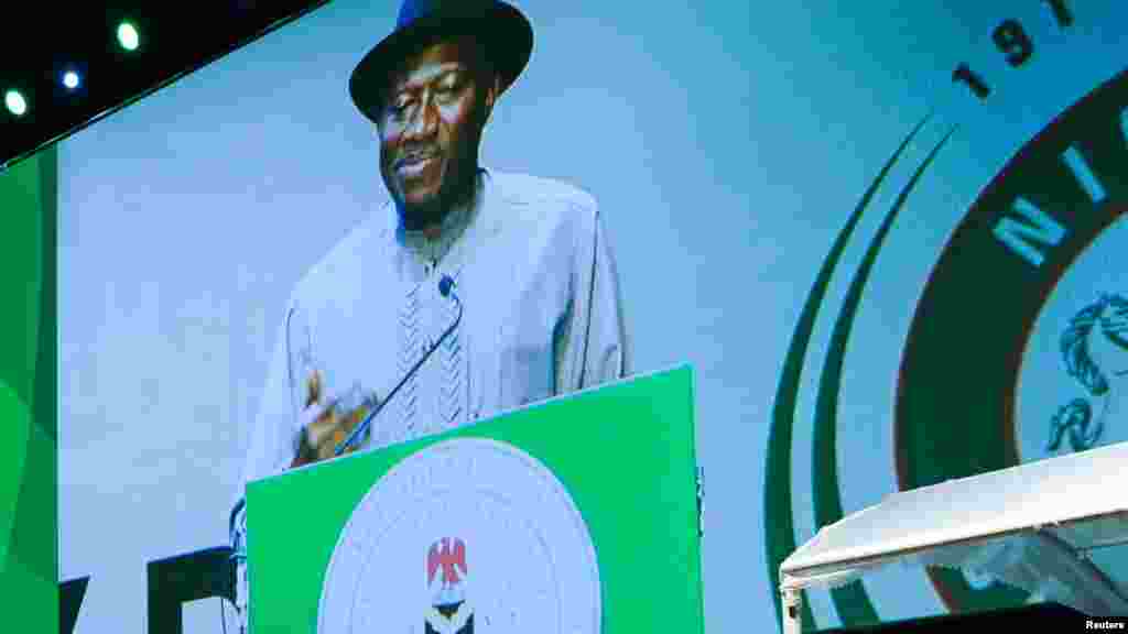 Nigeria&#39;s President Goodluck Jonathan on a screen projection addresses the audience during Democracy Day celebrations in Abuja May 29, 2013.